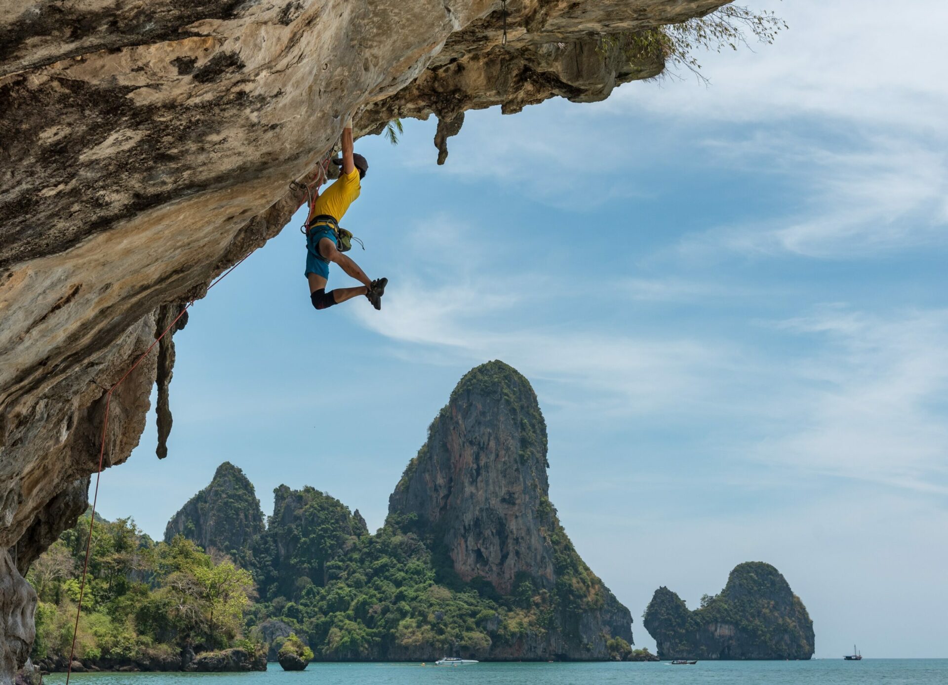 Man climbing a cliff