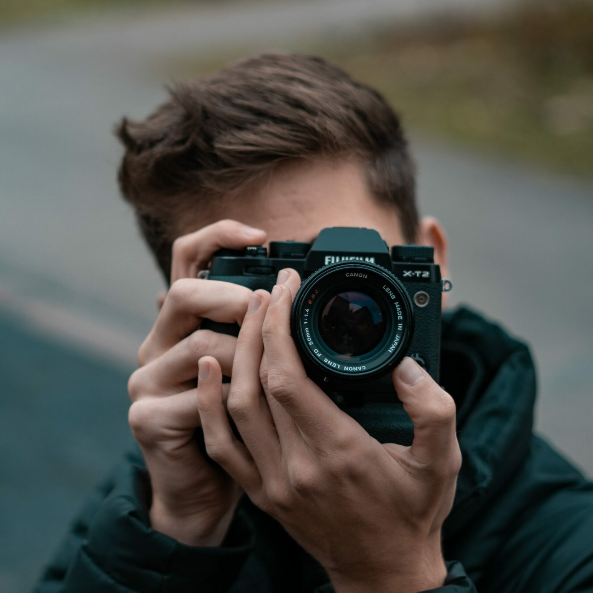 Man holding a Fujifilm camera